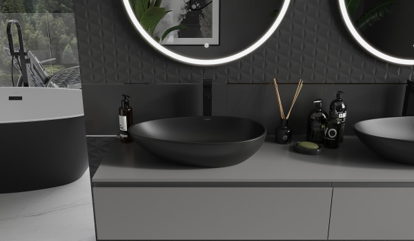 Lavabos en conglomérat dans une salle de bain gris-noir